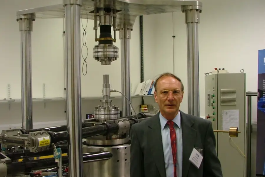 Man stood infront of large torque calibration machine