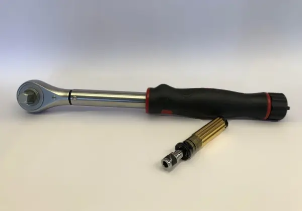 Torque wrench and small torque screwdriver on white background