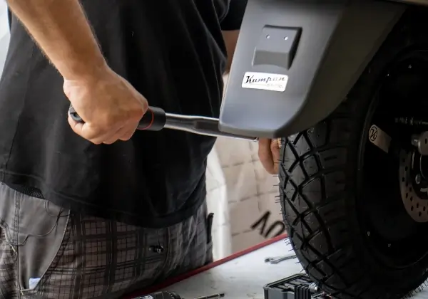 Torque wrench being used on a motorbike tyre