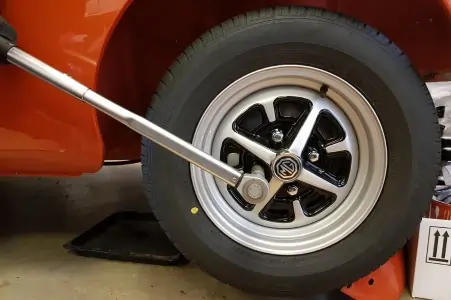Torque wrench tightening wheel bolt on an MG