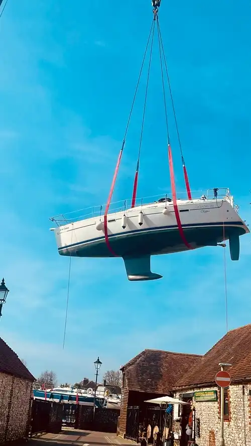 Boat being hoisted by a Crane