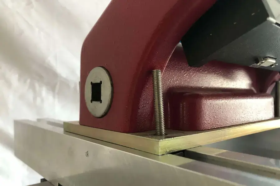 Close up of an AWS torque tester being mounted via base bolts