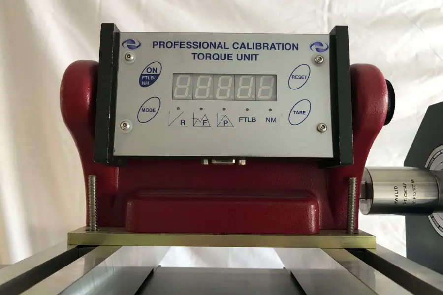 AWS torque tester being calibrated on a supported stand