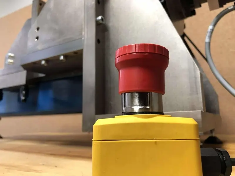 Big red emergency stop button for a large mechanical torque machine