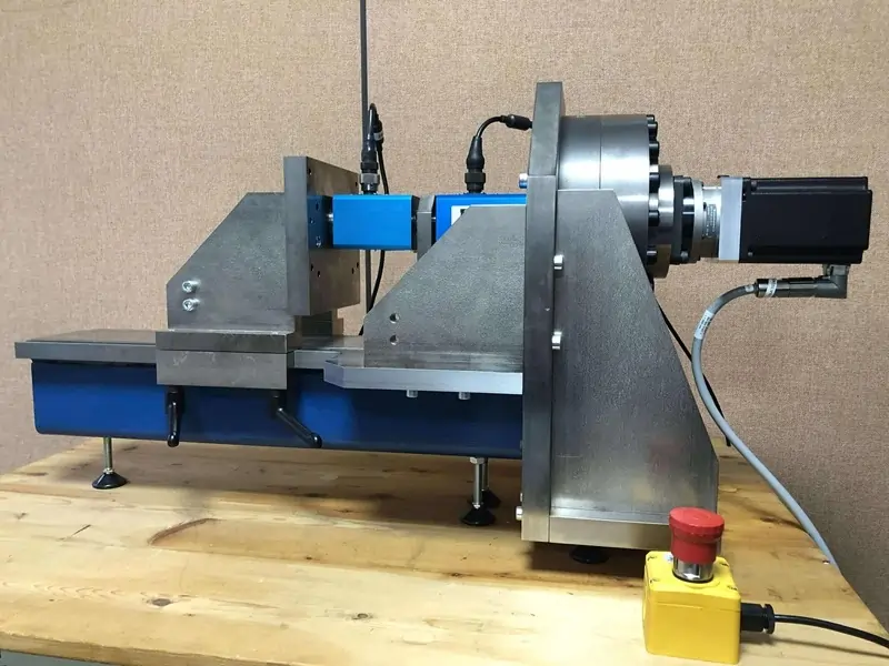 A torque transducer being calibrated in a motorised torque calibration machine