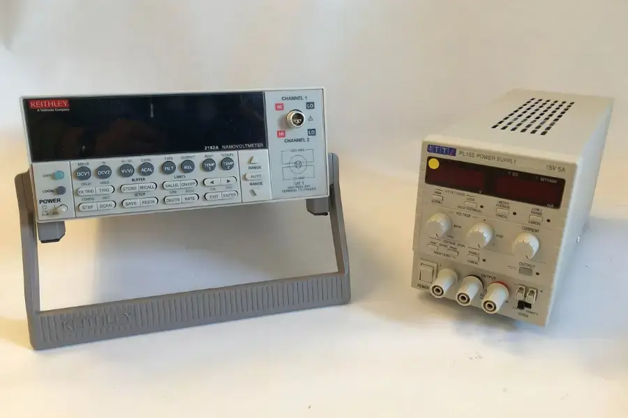 Keithly Nano Voltmeter next to a Power supply on a white background