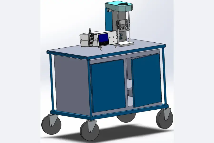 Torque screwdriver calibrator on top of a wheelable blue metal cabinet