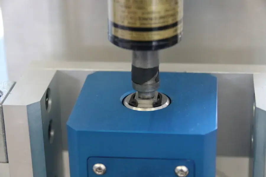Close up of torque screwdriver applying torque to a transducer