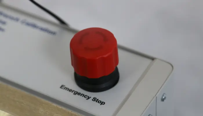 Red Emergency Stop Button on a torque wrench calibrator