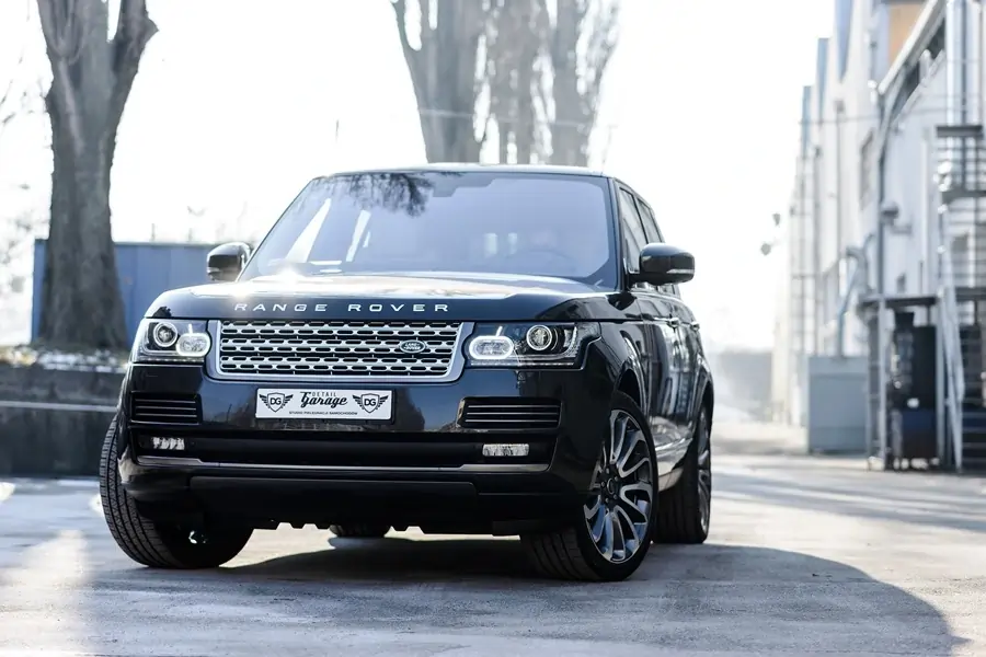 Range rover parked down a slim street