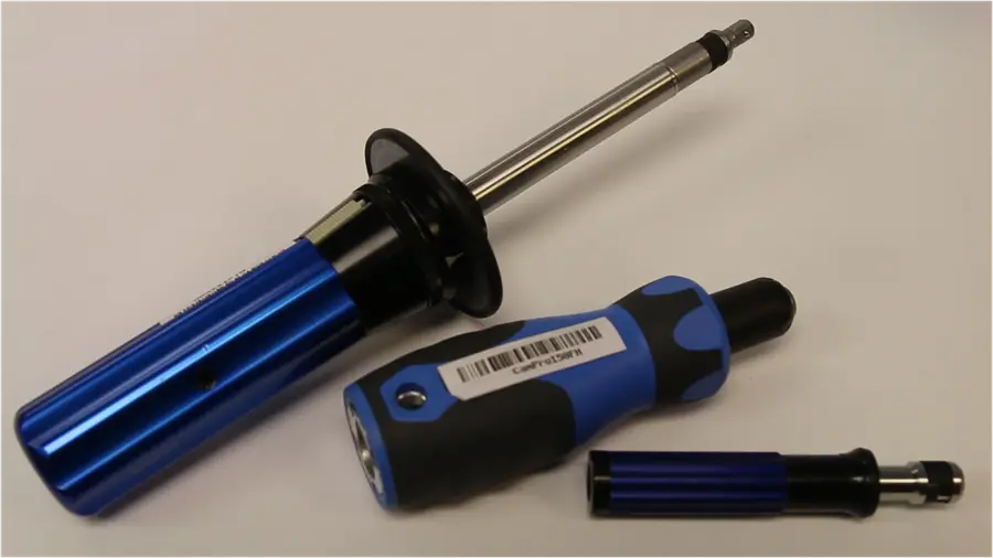 3 blue Gedore torque screwdrivers laying on a white table