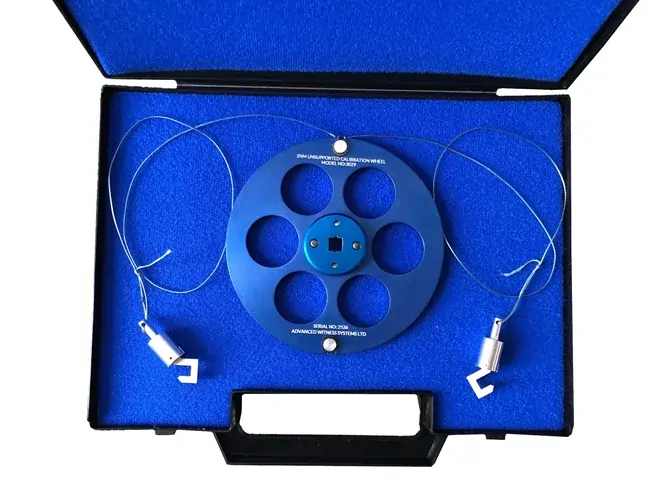 Blue torque wheel in blue carry case on a white background