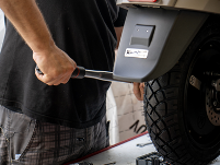 Man using torque wrench in automotive industry